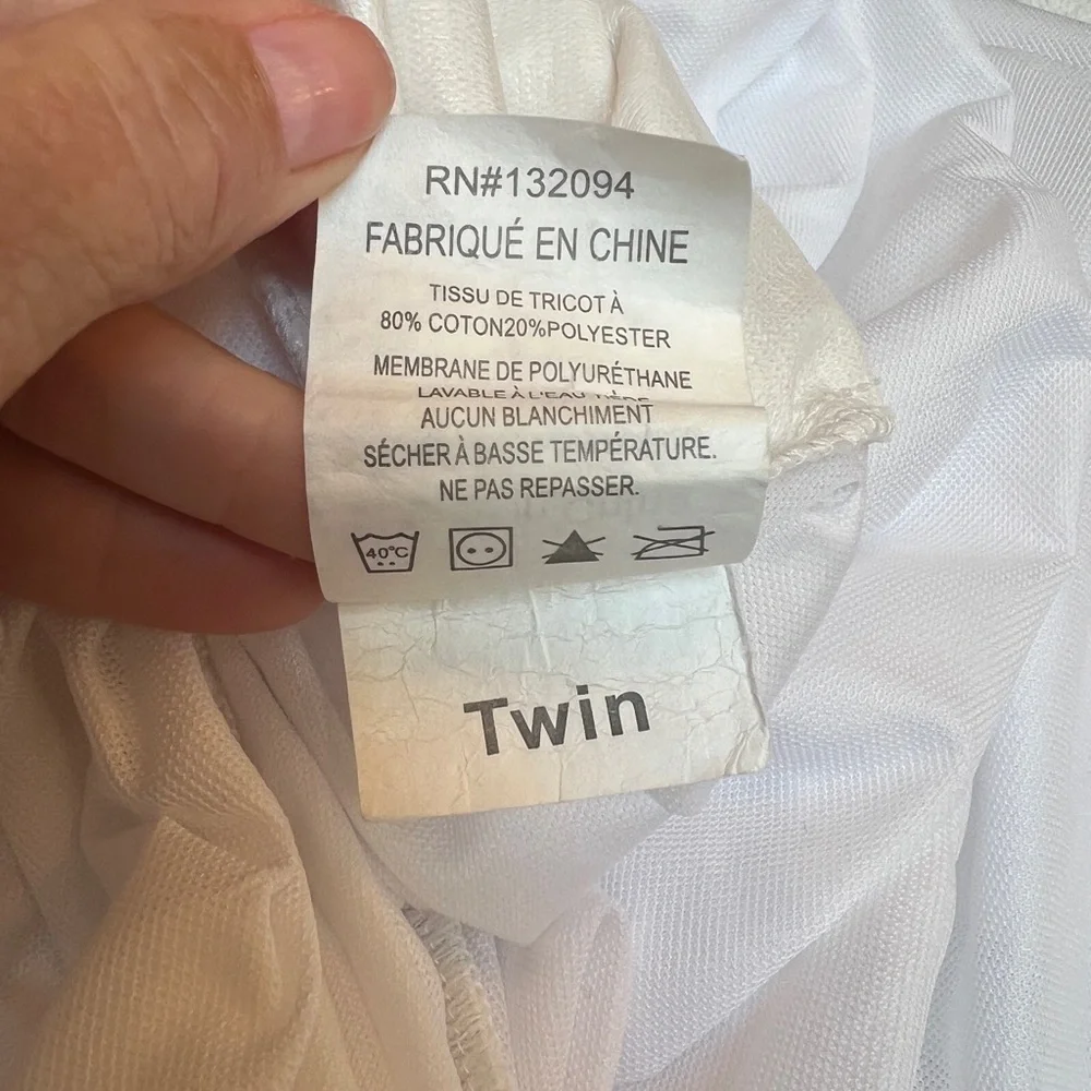 White twin waterproof mattress cover - to protect twin sized mattress. Like new